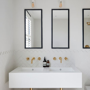 Design ideas for a scandi bathroom in London with open cabinets, white tiles, ceramic tiles, white walls, an integrated sink and white worktops.