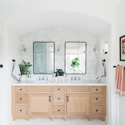 Transitional white tile white floor and double-sink bathroom photo in Los Angeles with flat-panel cabinets, beige cabinets, white walls, an undermount sink and white countertops