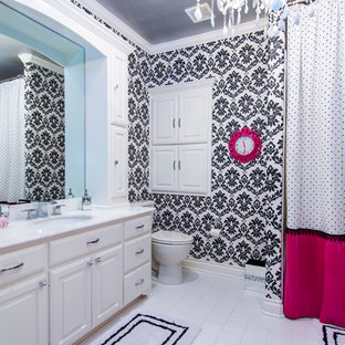 Mid-sized trendy kids' white tile and ceramic tile ceramic tile bathroom photo in Dallas with open cabinets, white cabinets, a two-piece toilet, black walls, an undermount sink and marble countertops