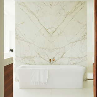 Design ideas for a modern bathroom in Sydney with a freestanding tub, white tile, white walls and white floor.
