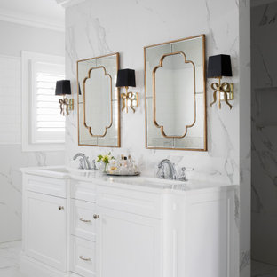 This is an example of a large transitional master bathroom in Brisbane with recessed-panel cabinets, white cabinets, grey walls, an undermount sink, grey floor, grey benchtops, a double vanity and a built-in vanity.