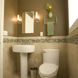Example of a trendy mosaic tile travertine floor bathroom design in San Francisco with brown walls, a two-piece toilet and a pedestal sink