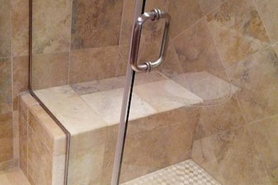 Small elegant 3/4 beige tile ceramic tile corner shower photo in Los Angeles with a vessel sink, flat-panel cabinets, dark wood cabinets, a two-piece toilet and beige walls