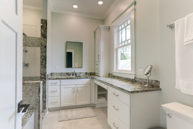 Transitional master bathroom photo in New Orleans with flat-panel cabinets, white cabinets and granite countertops