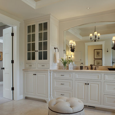 Inspiration for a timeless beige tile bathroom remodel in San Francisco with raised-panel cabinets and white cabinets