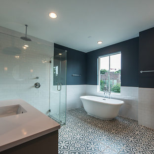 Inspiration for a farmhouse master white tile gray floor bathroom remodel in Houston with shaker cabinets, gray cabinets, blue walls, an undermount sink, quartzite countertops, a hinged shower door and white countertops