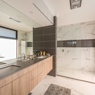 This is an example of a contemporary master bathroom in Other with flat-panel cabinets, light wood cabinets, a curbless shower, an undermount sink, white floor, an open shower and grey benchtops.
