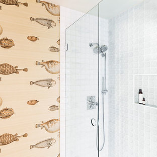 Mid-sized mid-century modern white tile and porcelain tile alcove shower photo in Portland with a hinged shower door