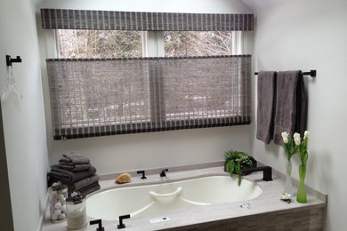 Bathroom - mid-sized traditional 3/4 bathroom idea in Boston with an undermount tub and gray walls