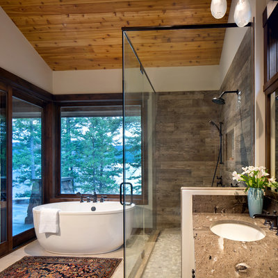 Mountain style brown tile beige floor bathroom photo in Other with white walls, an undermount sink, a hinged shower door and brown countertops
