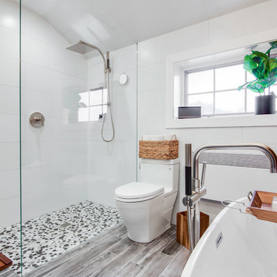 Example of a mid-sized trendy master black and white tile and ceramic tile ceramic tile bathroom design in New York with recessed-panel cabinets, gray cabinets, a one-piece toilet, gray walls, an undermount sink and granite countertops