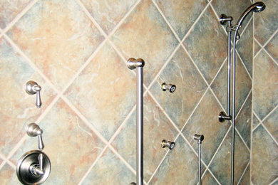Example of a large transitional master brown tile walk-in shower design in Oklahoma City
