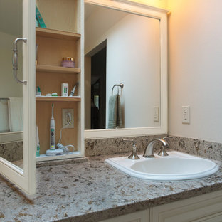 Bathroom - large traditional master beige tile and porcelain tile porcelain tile bathroom idea in Seattle with a drop-in sink, raised-panel cabinets, white cabinets, quartz countertops, a two-piece toilet and white walls