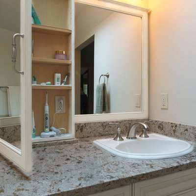 Bathroom - large traditional master beige tile and porcelain tile porcelain tile bathroom idea in Seattle with a drop-in sink, raised-panel cabinets, white cabinets, quartz countertops, a two-piece toilet and white walls