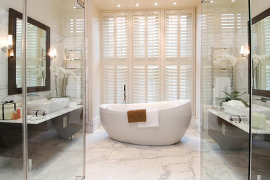 Design ideas for a large modern bathroom in London with a freestanding bath, white walls and white floors.