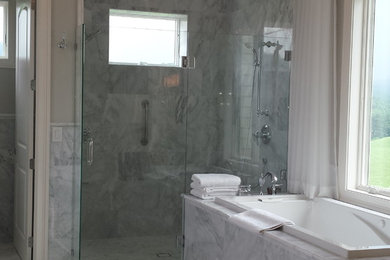 Bathroom - marble floor bathroom idea in Charlotte with gray walls