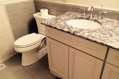 Bathroom - mid-sized bathroom idea in Seattle with an undermount sink and quartzite countertops