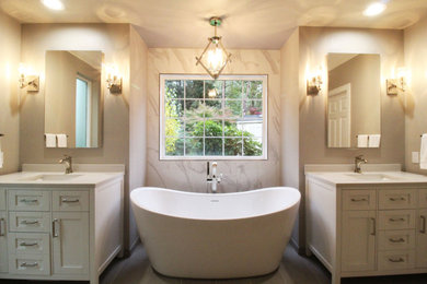 Design ideas for a medium sized classic ensuite bathroom in Seattle with shaker cabinets, white cabinets, a freestanding bath, an alcove shower, a two-piece toilet, white tiles, ceramic tiles, grey walls, ceramic flooring, a submerged sink, engineered stone worktops, grey floors, a hinged door, white worktops, a wall niche, double sinks, a freestanding vanity unit and a coffered ceiling.