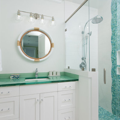 Inspiration for a coastal kids' blue tile and mosaic tile white floor corner shower remodel in Other with shaker cabinets, white cabinets, white walls, an undermount sink, glass countertops, a hinged shower door and green countertops