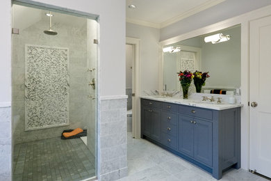 Elegant gray tile gray floor alcove shower photo in Minneapolis with an undermount sink, recessed-panel cabinets and blue cabinets