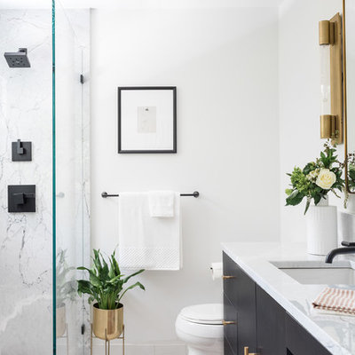 Bathroom - mid-sized contemporary 3/4 marble tile, gray tile and white tile white floor bathroom idea in Boston with flat-panel cabinets, black cabinets, a one-piece toilet, white walls, an undermount sink, marble countertops and gray countertops
