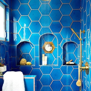 Inspiration for an eclectic master bathroom in Los Angeles with blue tile, ceramic tile, blue walls and ceramic floors.