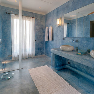 Inspiration for a large mediterranean wet room bathroom in Hertfordshire with blue walls, blue floors, an open shower and blue worktops.