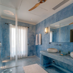 Photo of a mediterranean shower room bathroom in Hertfordshire with an alcove shower, blue walls, a vessel sink, blue floors, an open shower and blue worktops.