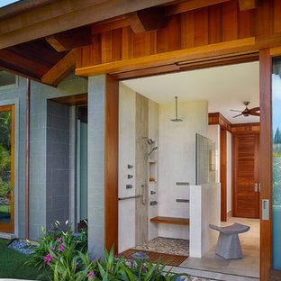 Example of an island style master beige tile bathroom design in Hawaii