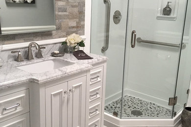 Photo of a traditional bathroom in Los Angeles with a submerged sink, freestanding cabinets, beige cabinets, marble worktops and white tiles.