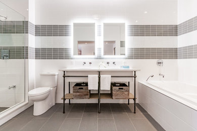 Transitional master gray tile and subway tile ceramic tile and gray floor bathroom photo in Ottawa with open cabinets, an integrated sink, quartzite countertops and a hinged shower door