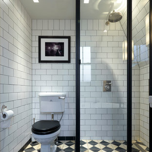 This is an example of a small victorian 3/4 wet room bathroom in London with a two-piece toilet, subway tile and an open shower.