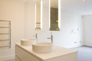 Design ideas for a contemporary bathroom in London with a console sink.
