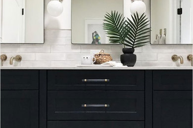 Inspiration for a mid-sized transitional ceramic tile porcelain tile bathroom remodel in Chicago with raised-panel cabinets, blue cabinets, white walls and quartz countertops