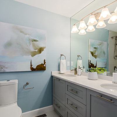 Example of a mid-sized transitional beige tile and ceramic tile ceramic tile bathroom design in Vancouver with shaker cabinets, gray cabinets, a two-piece toilet, blue walls and an undermount sink