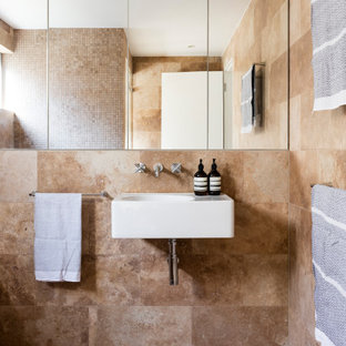 Design ideas for a mid-sized contemporary kids bathroom in Sydney with brown tile, travertine, travertine floors, a wall-mount sink and brown floor.