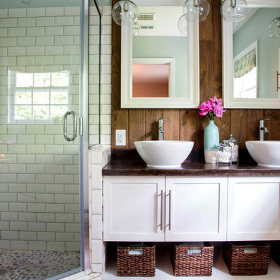 Corner shower - mid-sized eclectic master white tile and subway tile porcelain tile corner shower idea in Little Rock with a vessel sink, shaker cabinets, white cabinets, concrete countertops and green walls