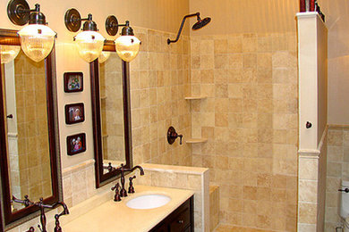 Example of a mid-sized transitional bathroom design in Wilmington with a drop-in sink, medium tone wood cabinets, granite countertops and beige walls