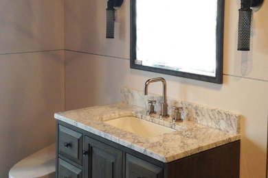 Example of a small transitional 3/4 bathroom design in Other with recessed-panel cabinets, dark wood cabinets, a one-piece toilet, gray walls and marble countertops