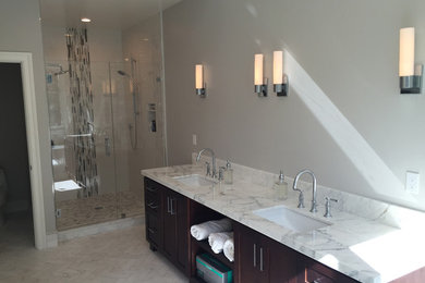 Medium sized classic ensuite bathroom in San Francisco with shaker cabinets, dark wood cabinets, an alcove shower, grey walls, a submerged sink, marble worktops, beige floors and a hinged door.