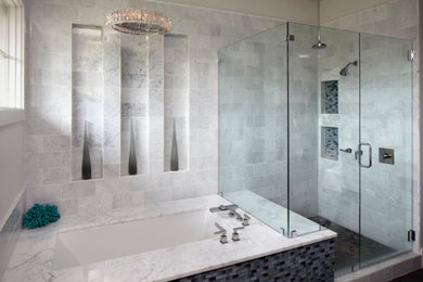 Corner shower - large contemporary master gray tile and stone tile porcelain tile and gray floor corner shower idea in Austin with an undermount tub, gray walls and a hinged shower door