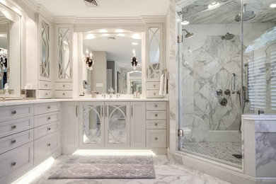 Inspiration for a traditional bathroom in New York with recessed-panel cabinets, grey cabinets, a double shower, grey tiles, marble tiles, marble flooring, granite worktops, grey floors and a hinged door.