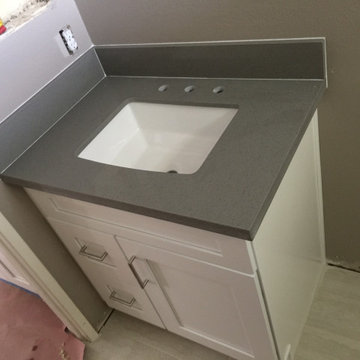 Kitchen white shaker cabinets Bathroom white shaker vanity with grey quartz tops