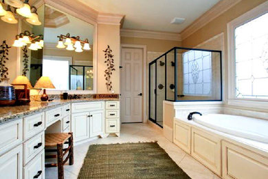 Inspiration for a large bathroom remodel in Atlanta with white cabinets, a hot tub and beige walls