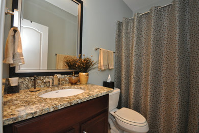 Example of an eclectic bathroom design in Charlotte