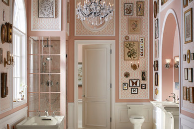 Bathroom - shabby-chic style master bathroom idea in Denver with a one-piece toilet, pink walls and a console sink