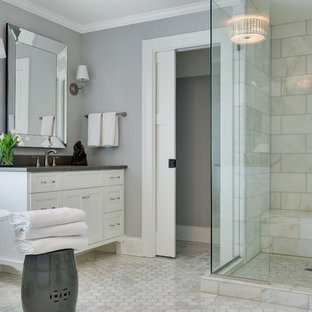 Design ideas for a medium sized beach style ensuite bathroom in Minneapolis with shaker cabinets, white cabinets, a claw-foot bath, white tiles, grey walls, white floors, a hinged door, marble tiles, marble flooring, a corner shower, a submerged sink and grey worktops.