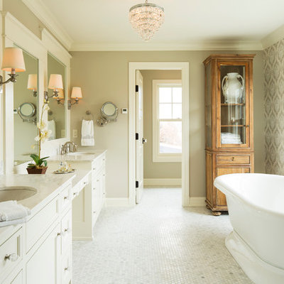 Farmhouse freestanding bathtub photo in Minneapolis with an undermount sink and marble countertops