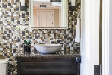 Bathroom - transitional 3/4 multicolored tile and mosaic tile dark wood floor and single-sink bathroom idea in Milwaukee with recessed-panel cabinets, dark wood cabinets, onyx countertops, brown countertops and a built-in vanity