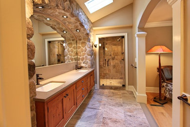 Example of a large mountain style master multicolored tile and porcelain tile pebble tile floor and multicolored floor alcove shower design in New York with shaker cabinets, distressed cabinets, a one-piece toilet, beige walls, an undermount sink, quartz countertops and a hinged shower door